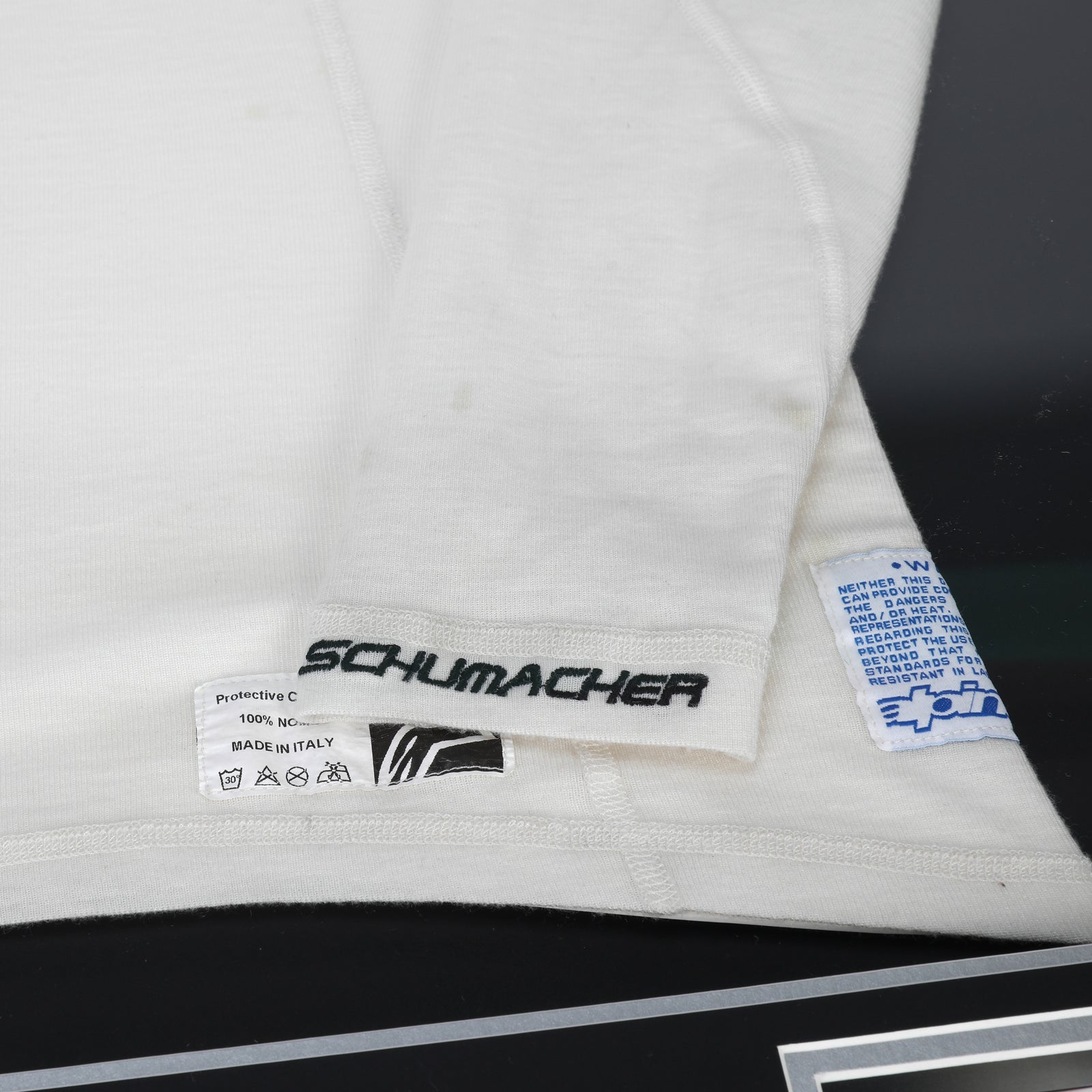 Season Launch LOT 027 - Michael Schumacher 2010 Mercedes Nomex - Framed