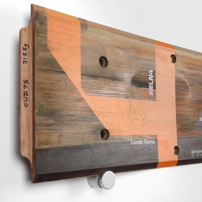 LOT 519 - Lando Norris 2024 McLaren F1 Team Race Used Skid Plank Wall Art - British GP