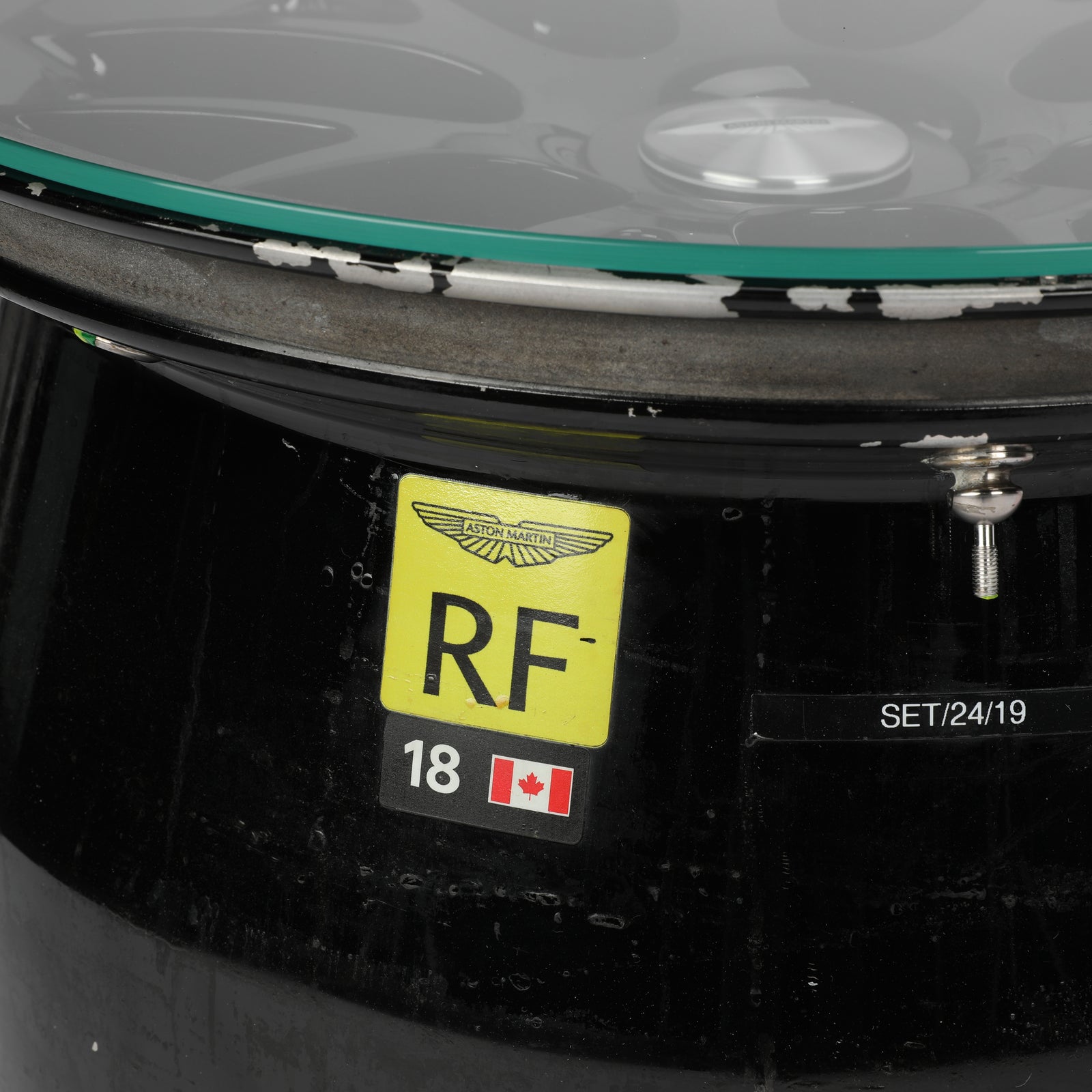 LOT 549 - Aston Martin Aramco Formula One® Team x Movember – Lance Stroll Suit & Wheel Rim