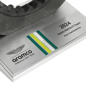 Authentic Aston Martin Aramco F1® Team brake disc on display, Formula 1 engineering collectible for motorsport enthusiasts and collectors