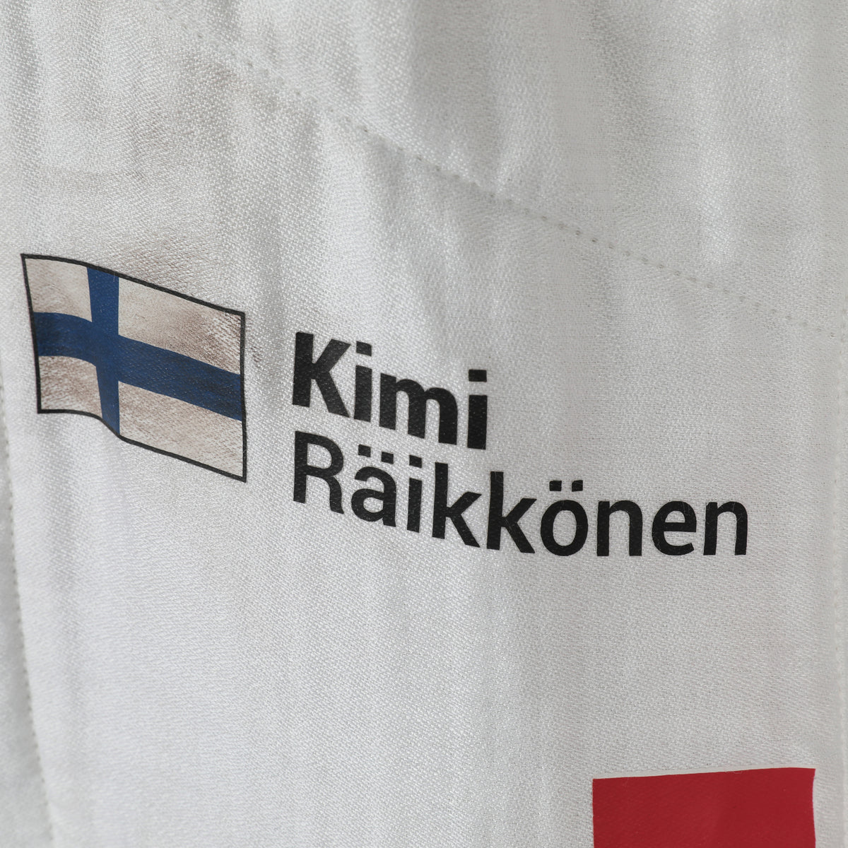 The Austin Auction LOT 008 - Kimi Raikkonen Signed Alfa Romeo 2021 Suit