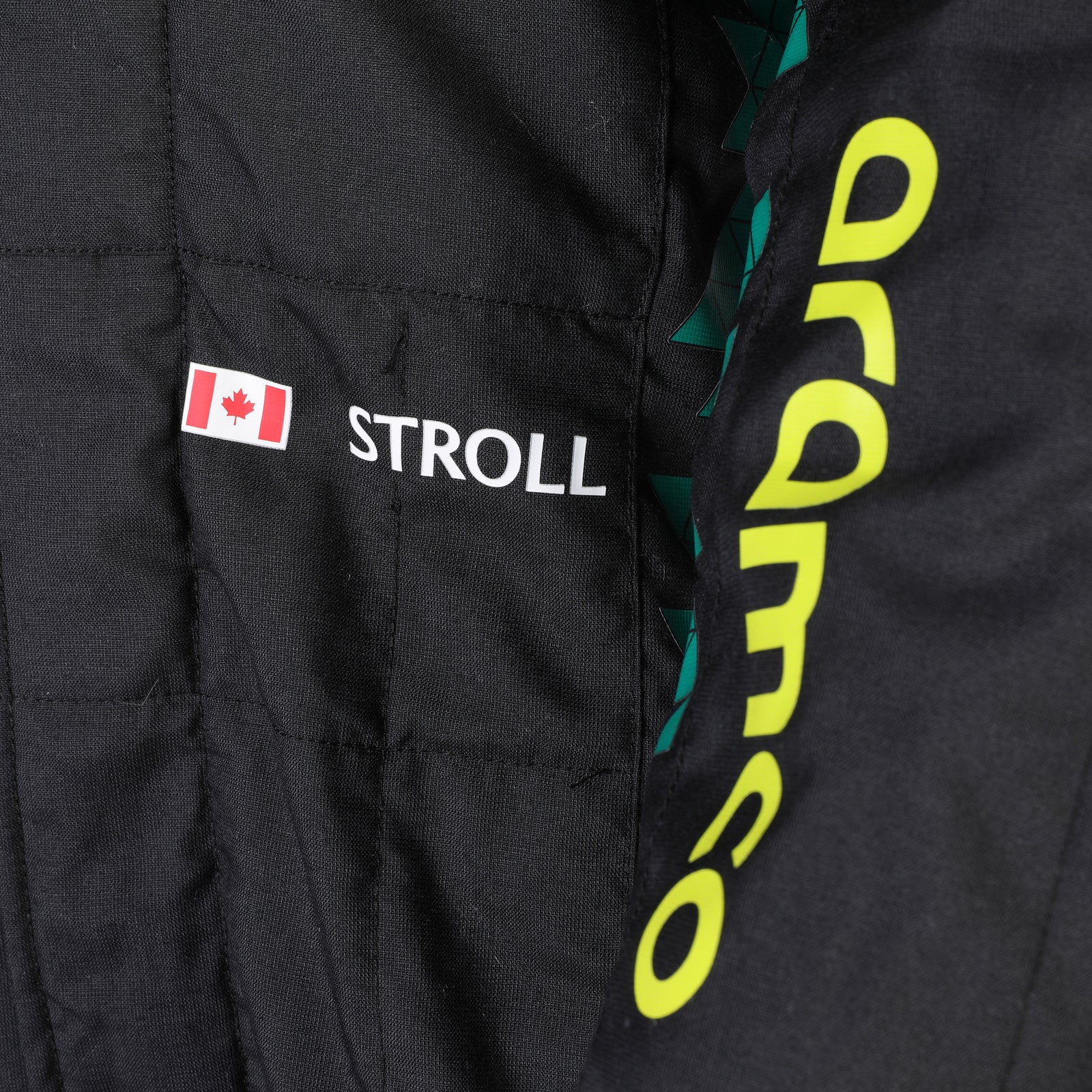 Aston Martin Formula One Team Lance Stroll 2025 race suit from the United States Grand Prix display item
