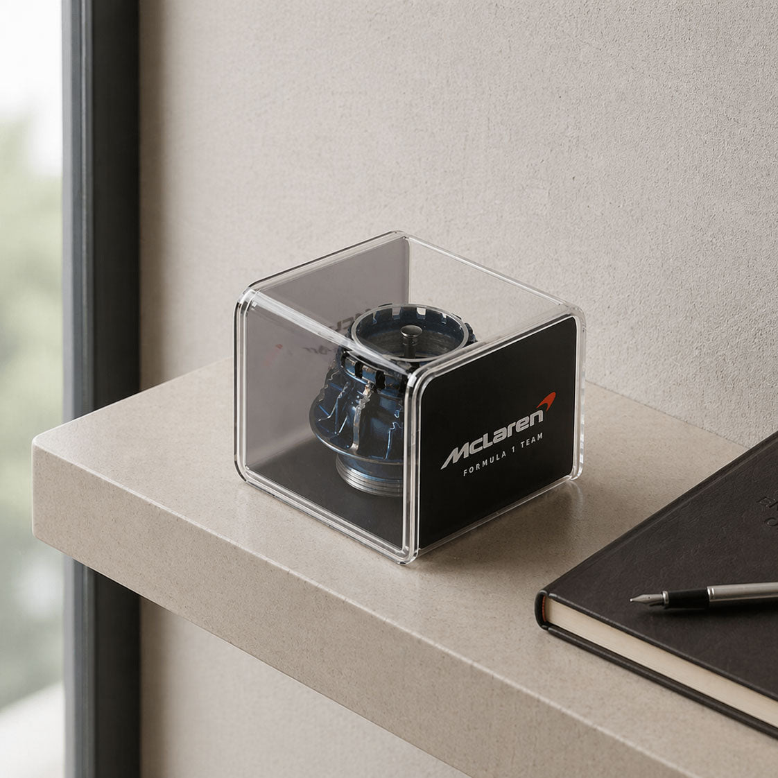 2023 McLaren race-used blue wheel nut presented in a premium display case, authentic Formula 1 engineering memorabilia