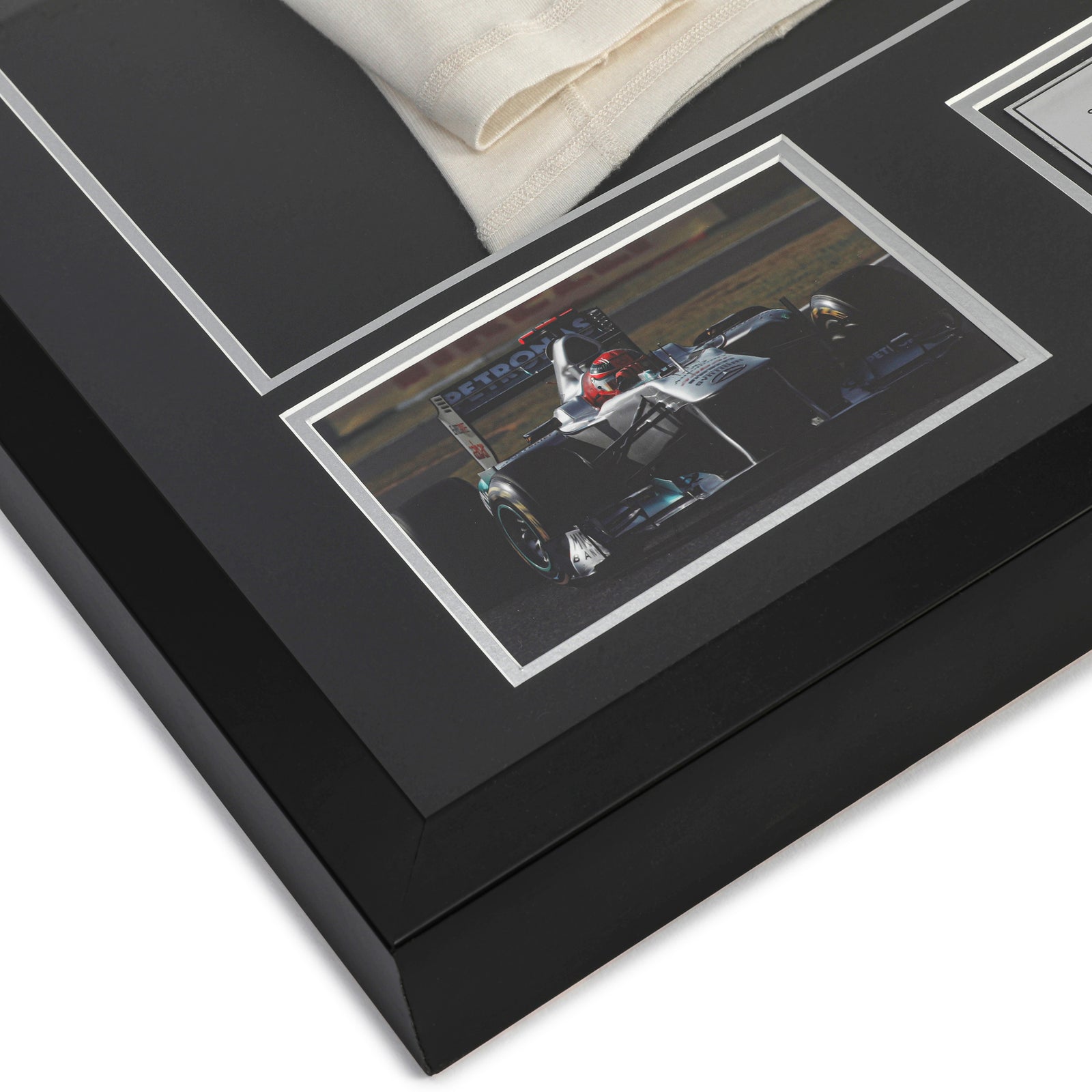 Miami Auction LOT 023 - Michael Schumacher 2010 Mercedes Nomex - Framed