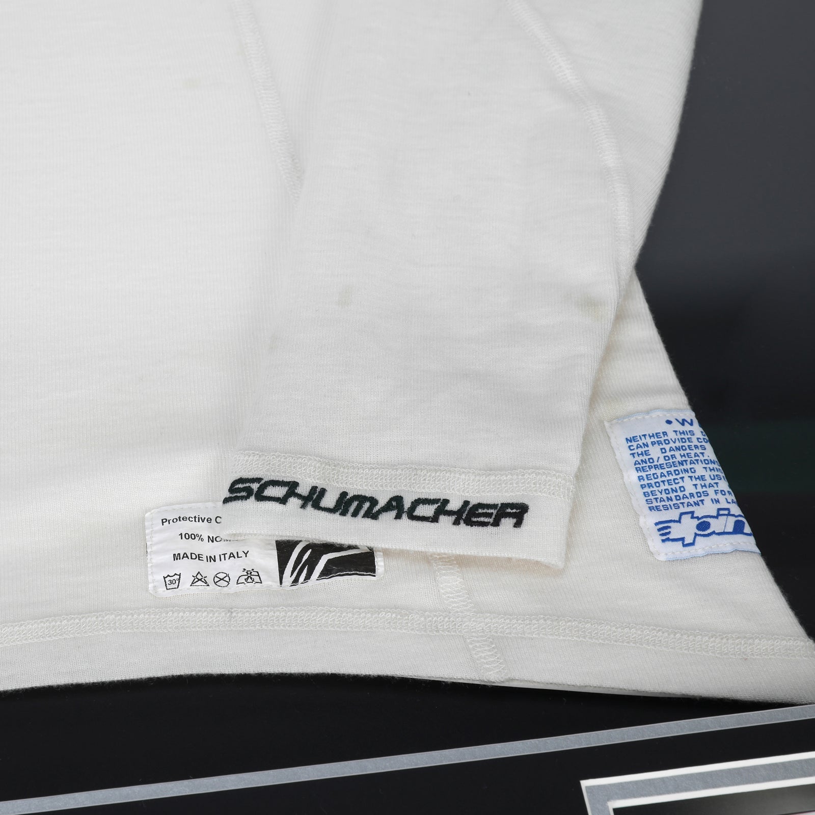 Miami Auction LOT 023 - Michael Schumacher 2010 Mercedes Nomex - Framed