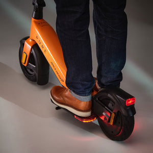 McLaren-inspired Pure x McLaren Papaya Edition electric scooter, premium urban e-scooter with bold papaya styling and modern design