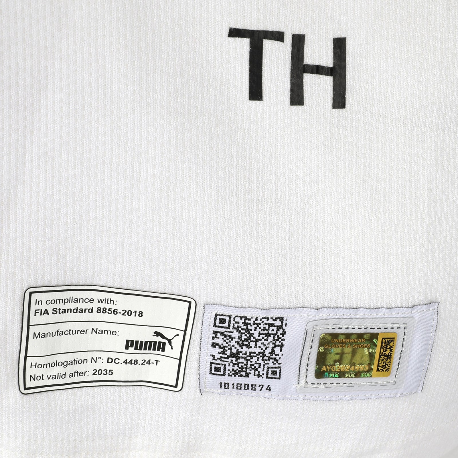 Auction LOT 126 - Tina Hausmann 2025 Aston Martin Aramco F1 Team Un-Signed Un-Used Nomex - White