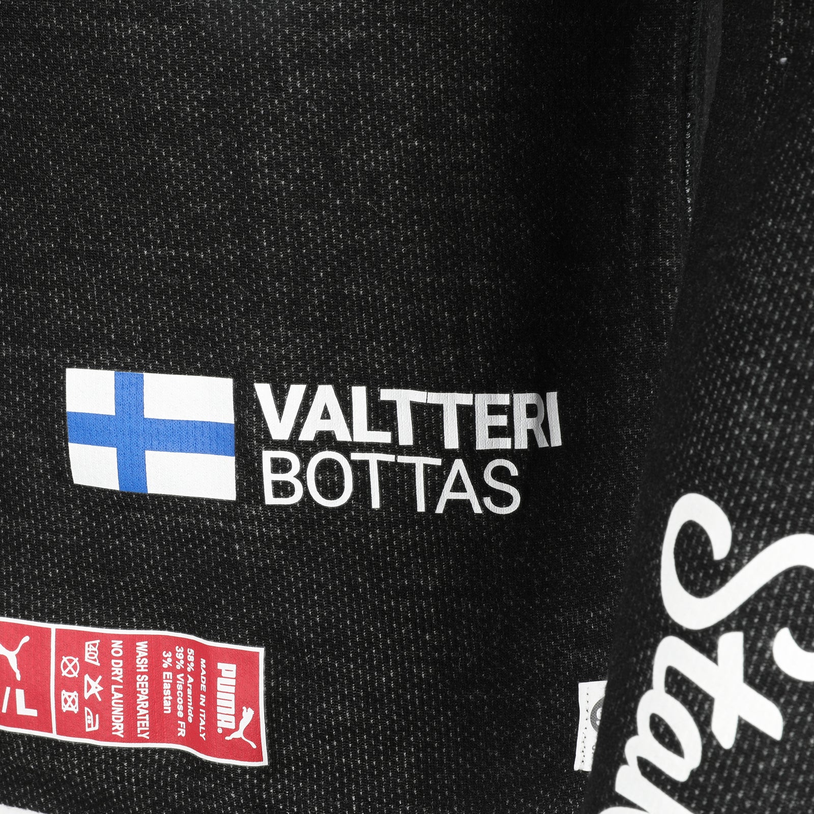 LOT 657 - Valtteri Bottas 2023 Season Signed Alfa Romeo F1 Team KICK Race Spec Nomex Top