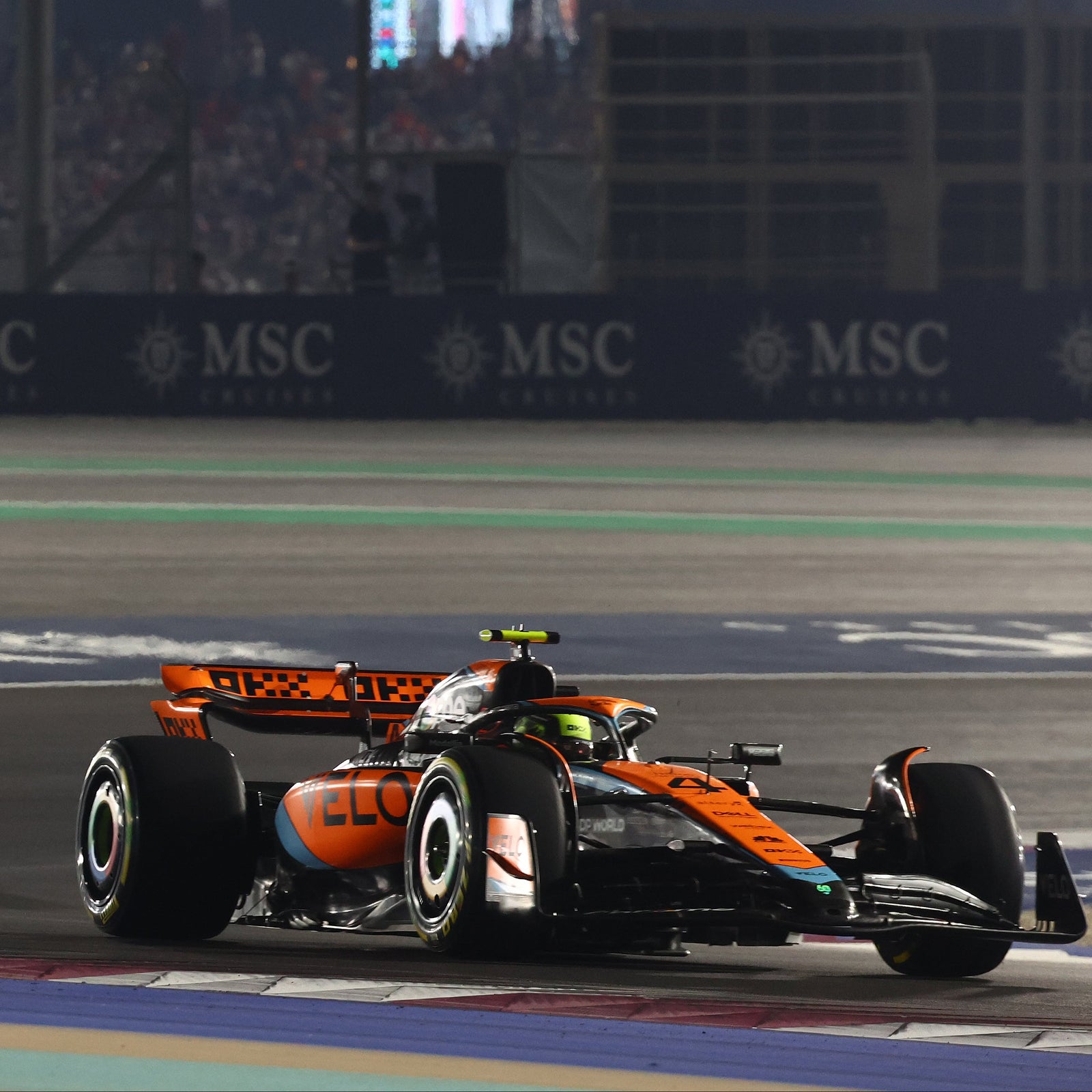 Lando Norris 2023 McLaren F1 Team front wheel rim table featuring a genuine Qatar Grand Prix-used Formula 1 component