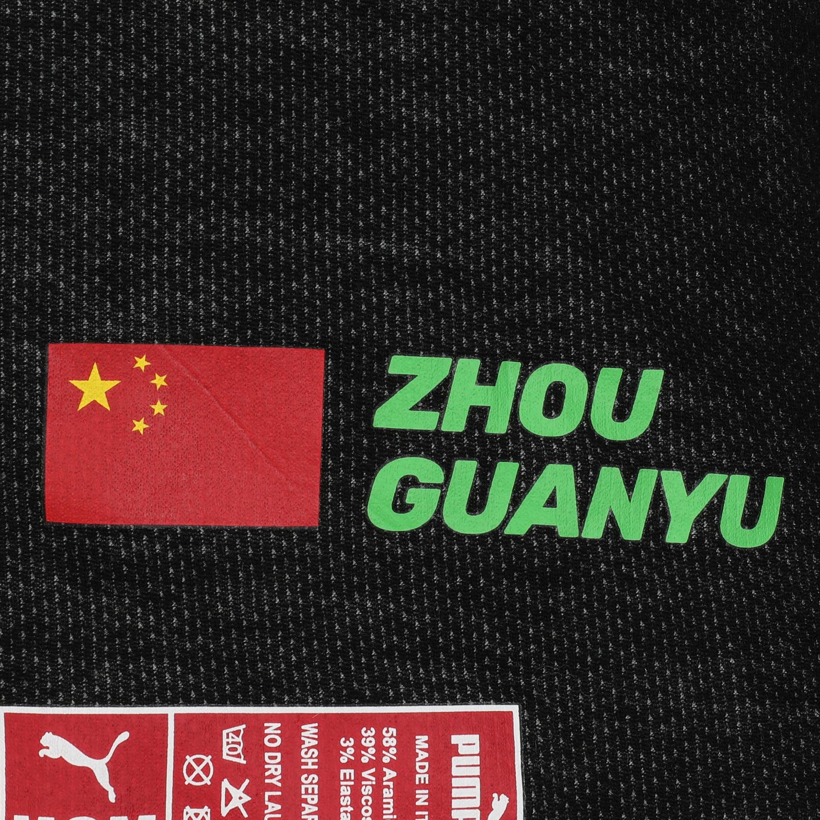 LOT 622 - Guanyu Zhou Signed 2024 Race Grand Prix Used Stake F1 Team Kick Sauber Nomex