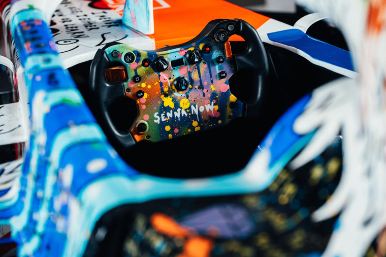 Ayrton Senna tribute art show car, full-size collector display vehicle combining Formula 1-inspired design with exclusive artistic presentation