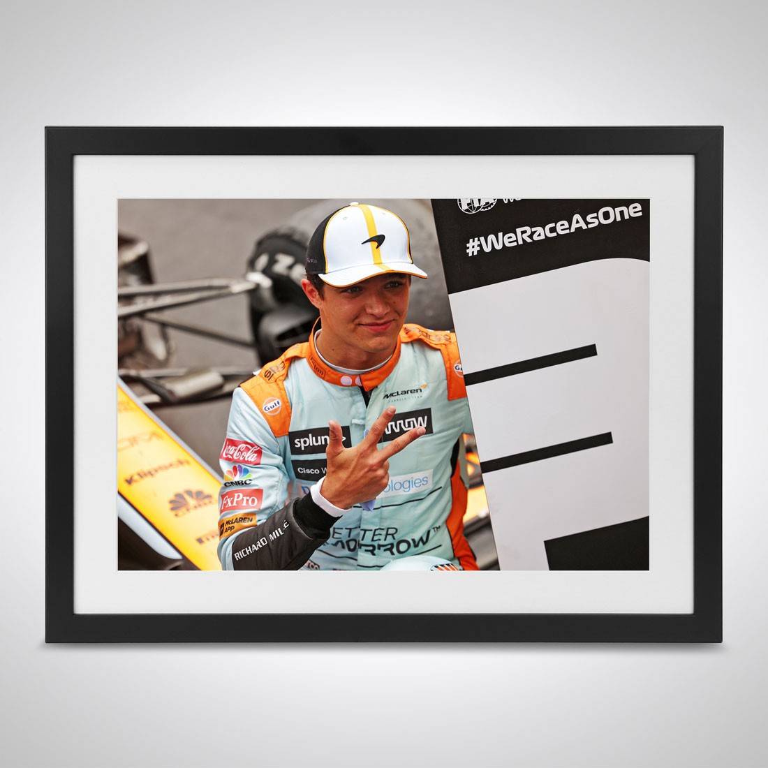 Framed photo of Lando Norris with his McLaren car at the Monaco circuit