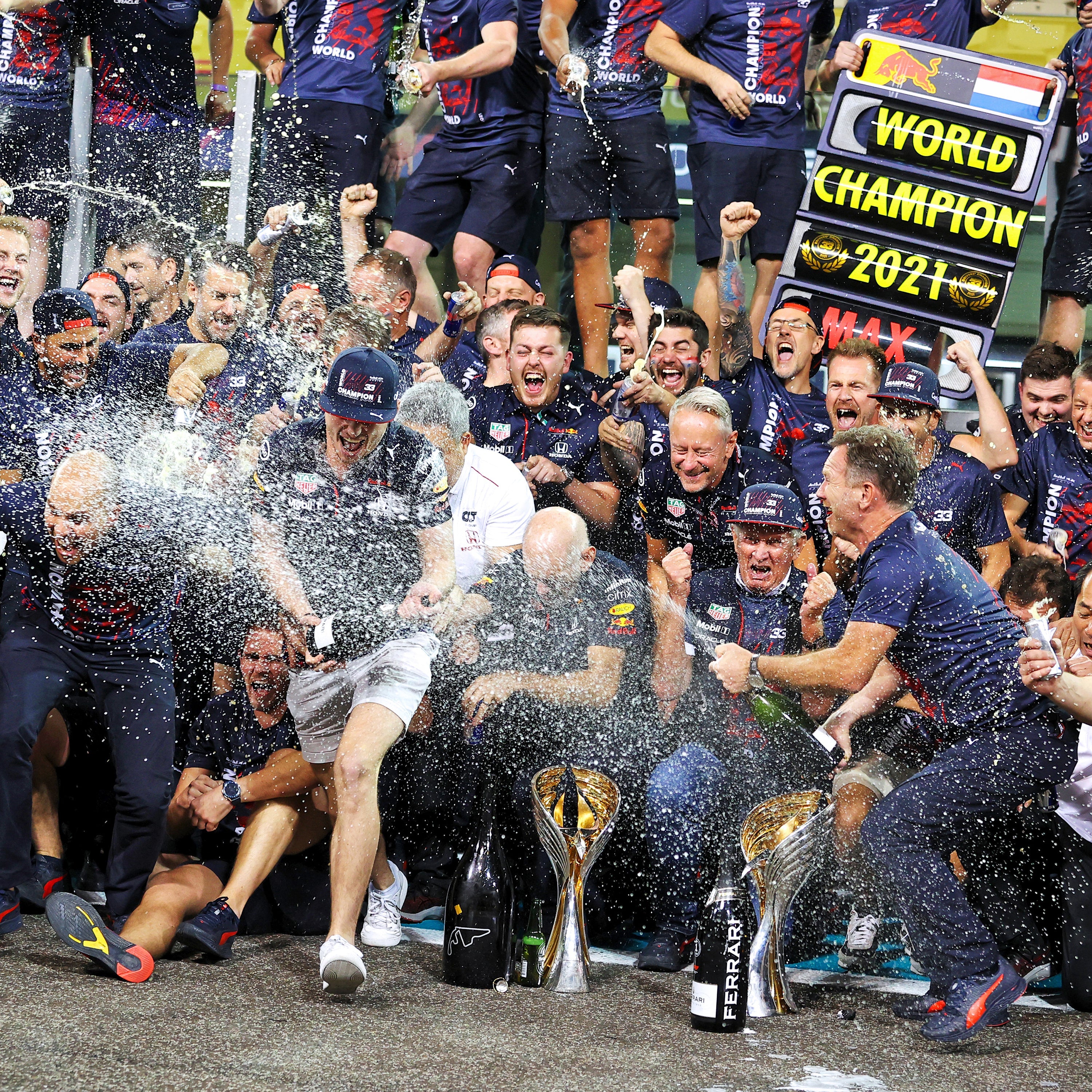 zoom in on "Picture of Max Verstappen in a crowd celebrating when he became a World Champion. square image